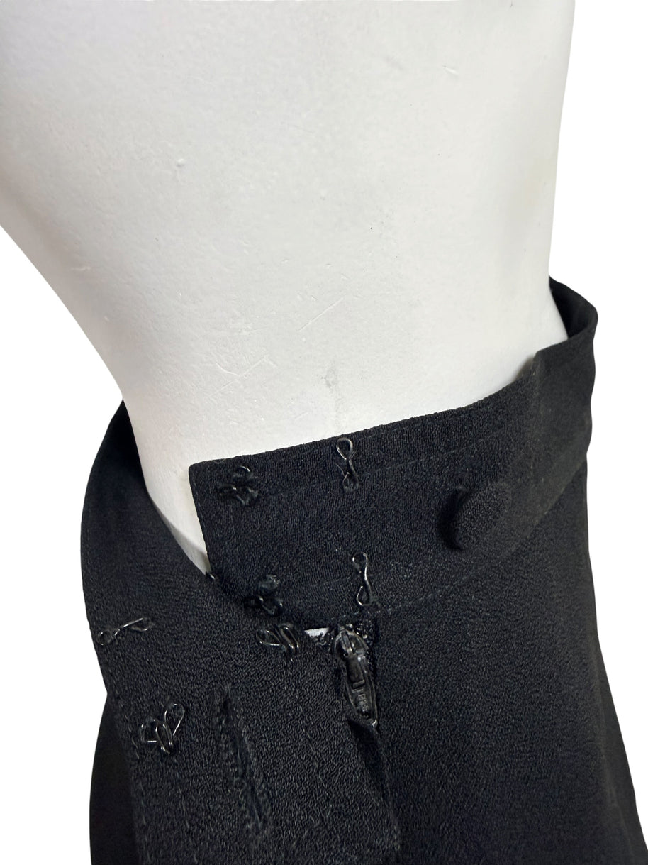 Interior construction of vintage Sonia Rykiel Paris trousers showing original hook-and-eye closures and concealed zipper.