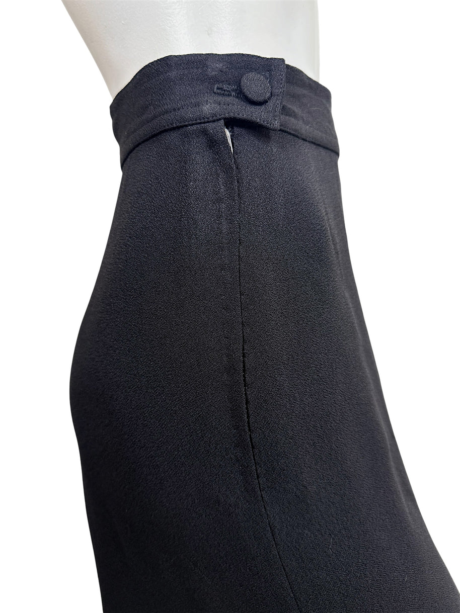 Close-up of the waist button and concealed side zipper closure on vintage Sonia Rykiel Paris black trousers.