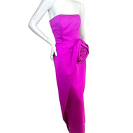 Vintage Victor Costa for Saks Fifth Avenue strapless fuchsia evening gown featuring an oversized sculptural rosette at the hip, elegant column silhouette, and dramatic draped detail shown in a front three-quarter view.